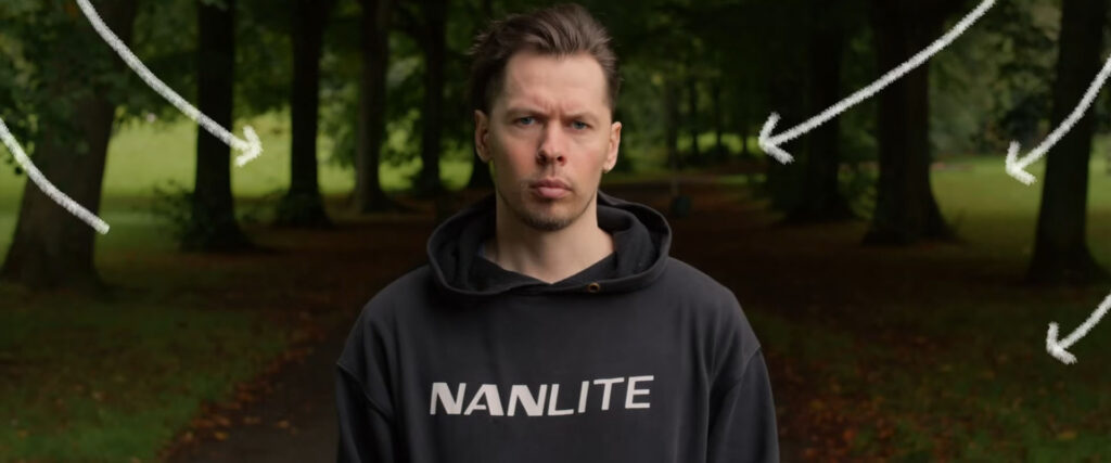 A man wearing a hoodie with "NANLITE" written on it stands in a park with arrows superimposed around him, pointing in various directions.